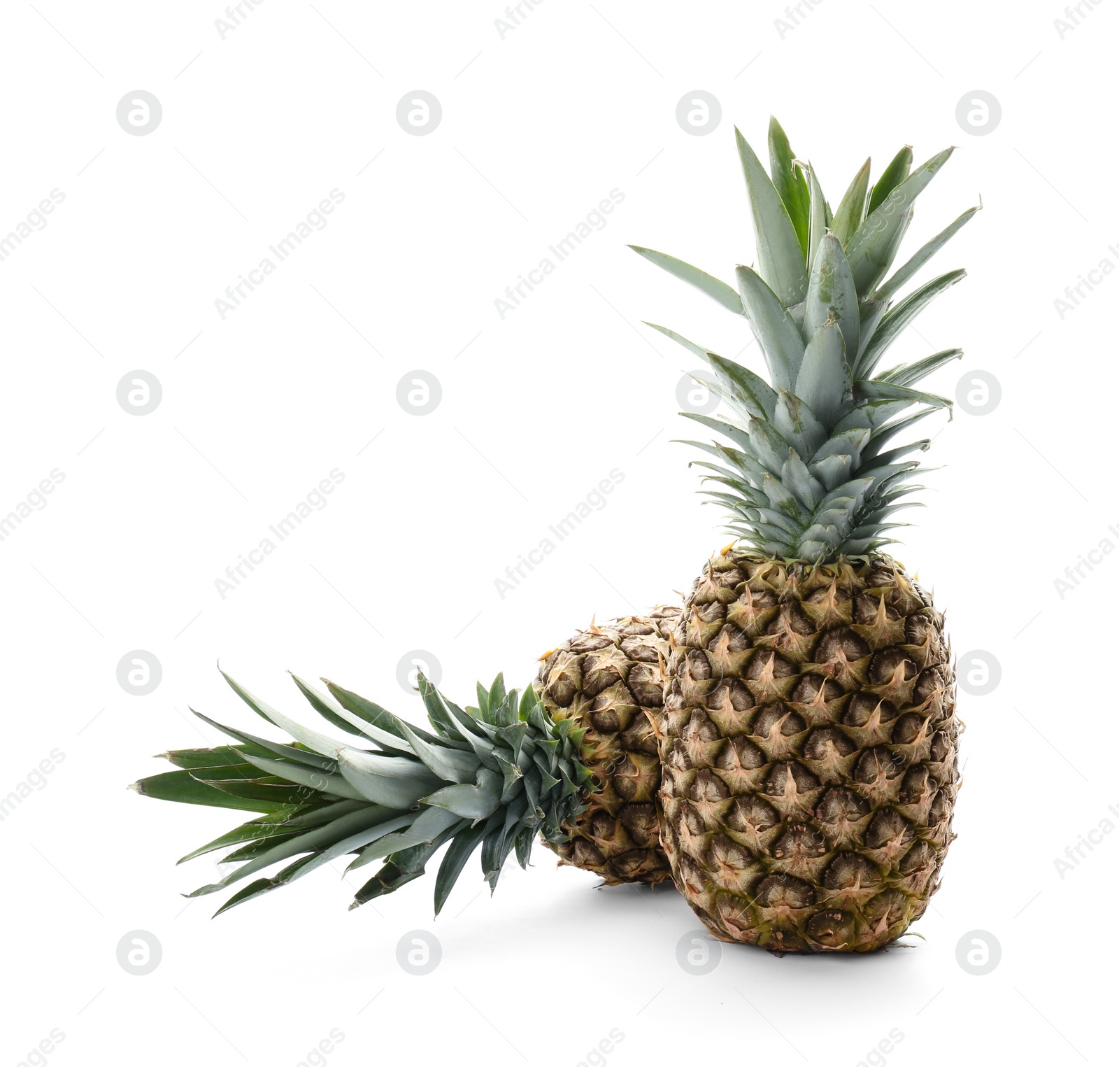 Photo of Fresh pineapples on white background