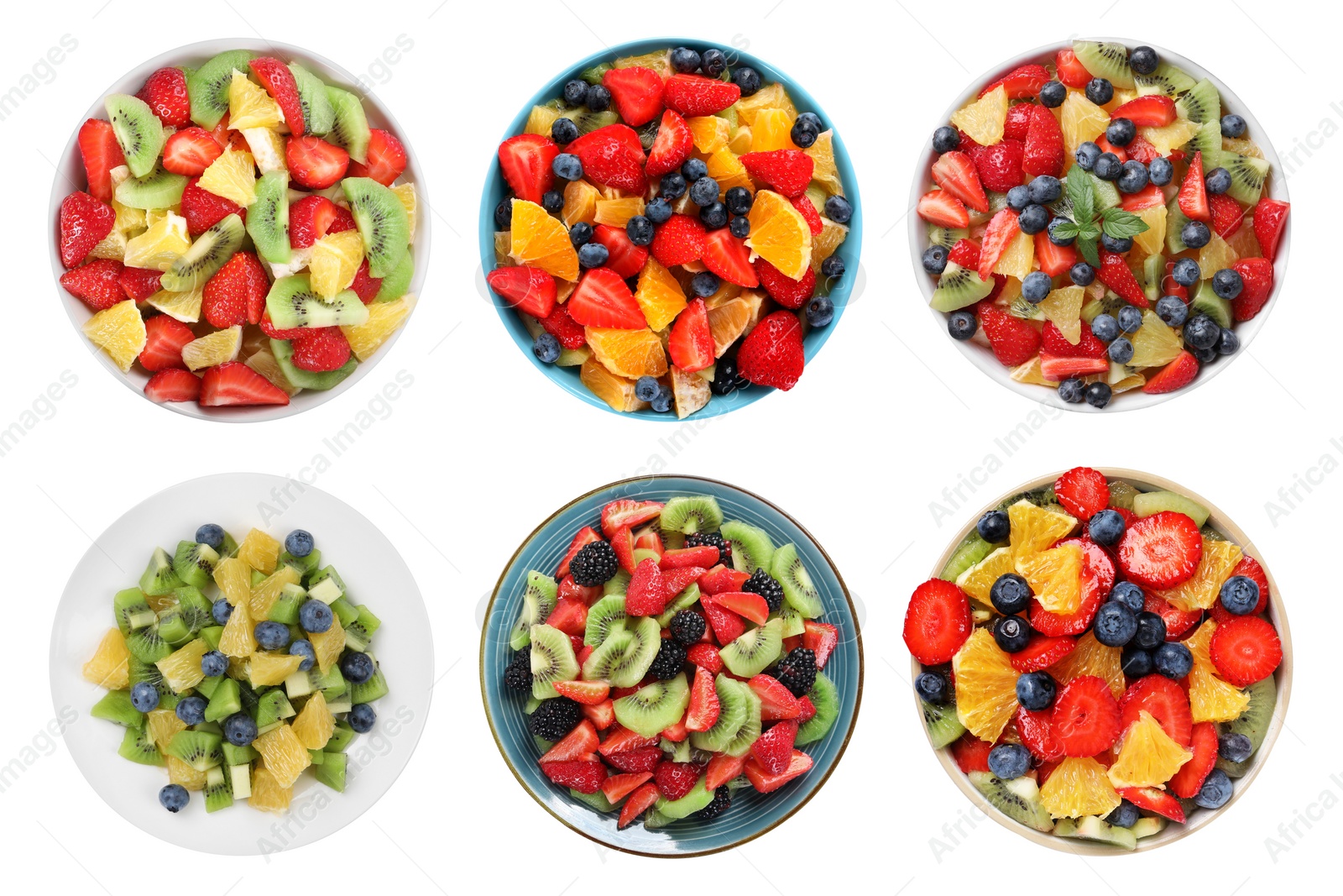 Image of Fruit salad, collection. Mixed fresh berries and fruits in bowls isolated on white, top view