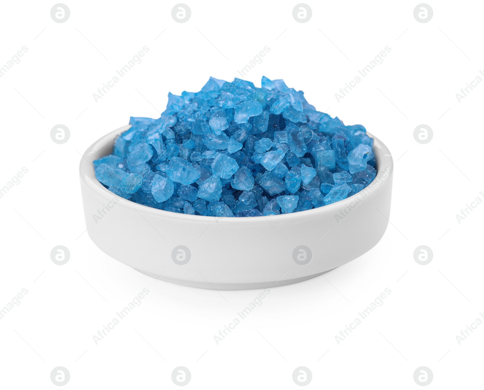 Photo of Bowl with blue sea salt isolated on white