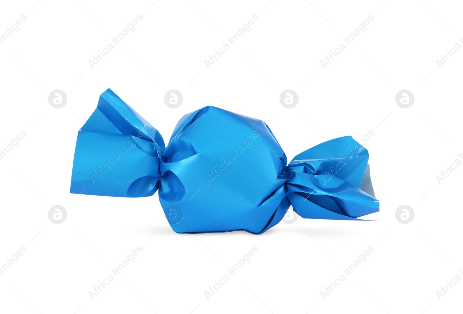 Photo of Delicious candy in light blue wrapper isolated on white