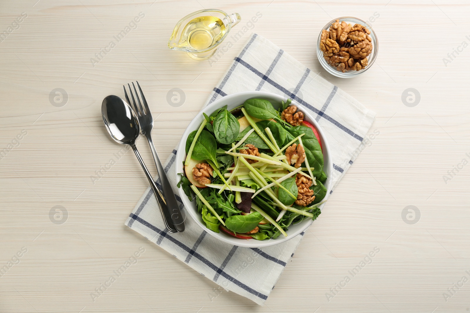 Photo of Delicious fresh celery salad served on white wooden table, flat lay