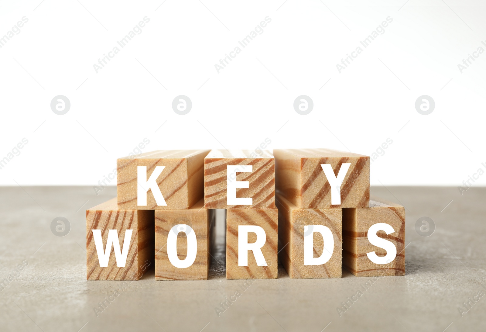 Photo of Blocks with word KEYWORDS on grey table