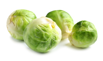 Fresh tasty Brussels sprouts on white background