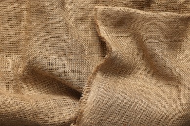 Photo of Texture of burlap fabric as background, top view