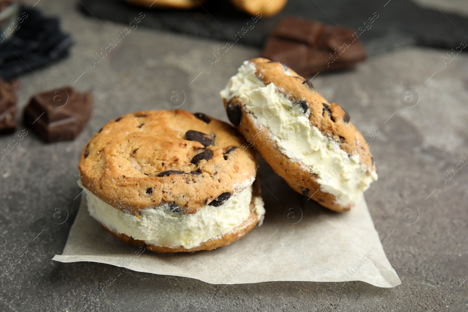 Photo of Sweet delicious ice cream cookie sandwiches on table