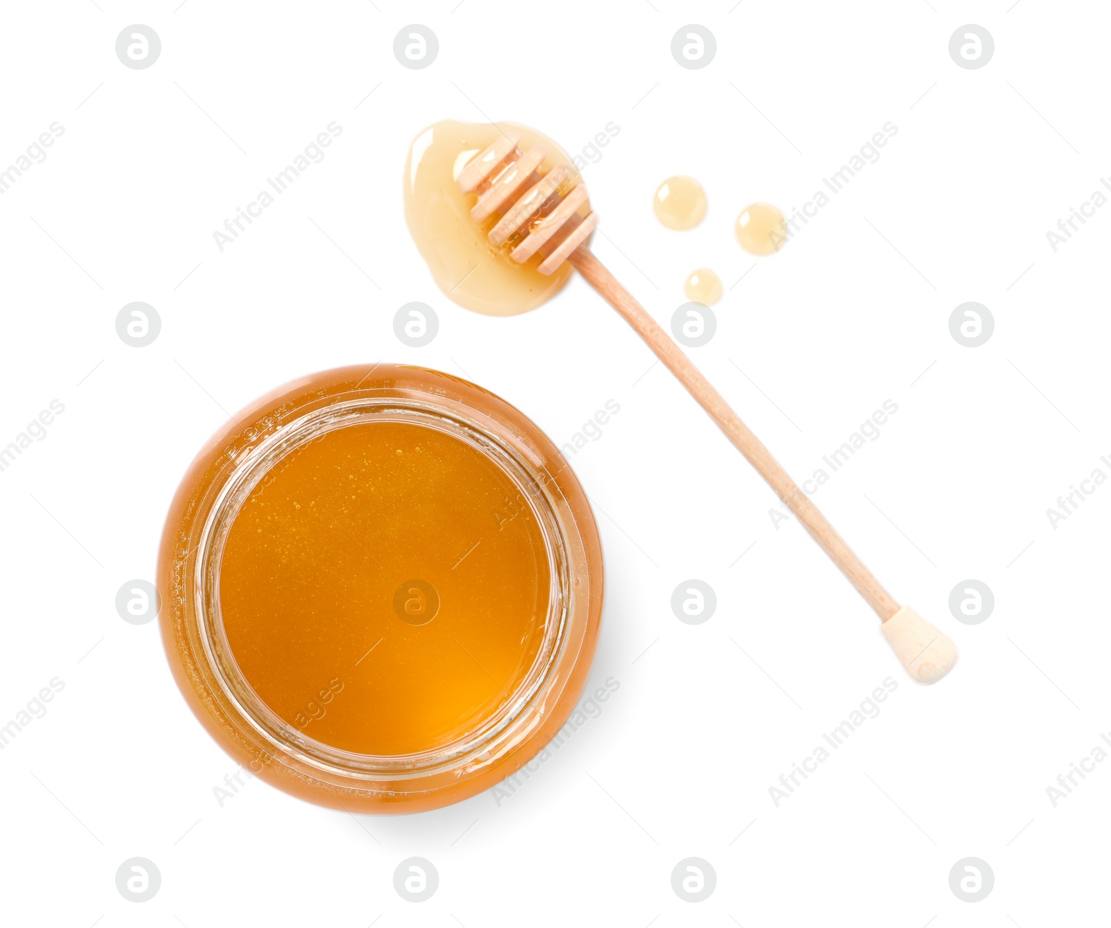 Photo of Tasty honey in glass jar and dipper isolated on white, top view