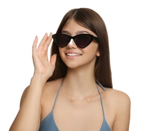 Teenage girl with sun protection cream on her nose against white background