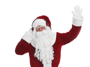Photo of Santa Claus with headphones listening to Christmas music on white background