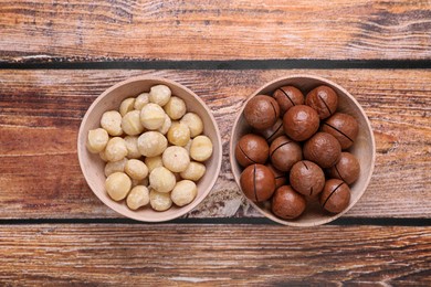 Photo of Delicious organic Macadamia nuts on wooden table, flat lay