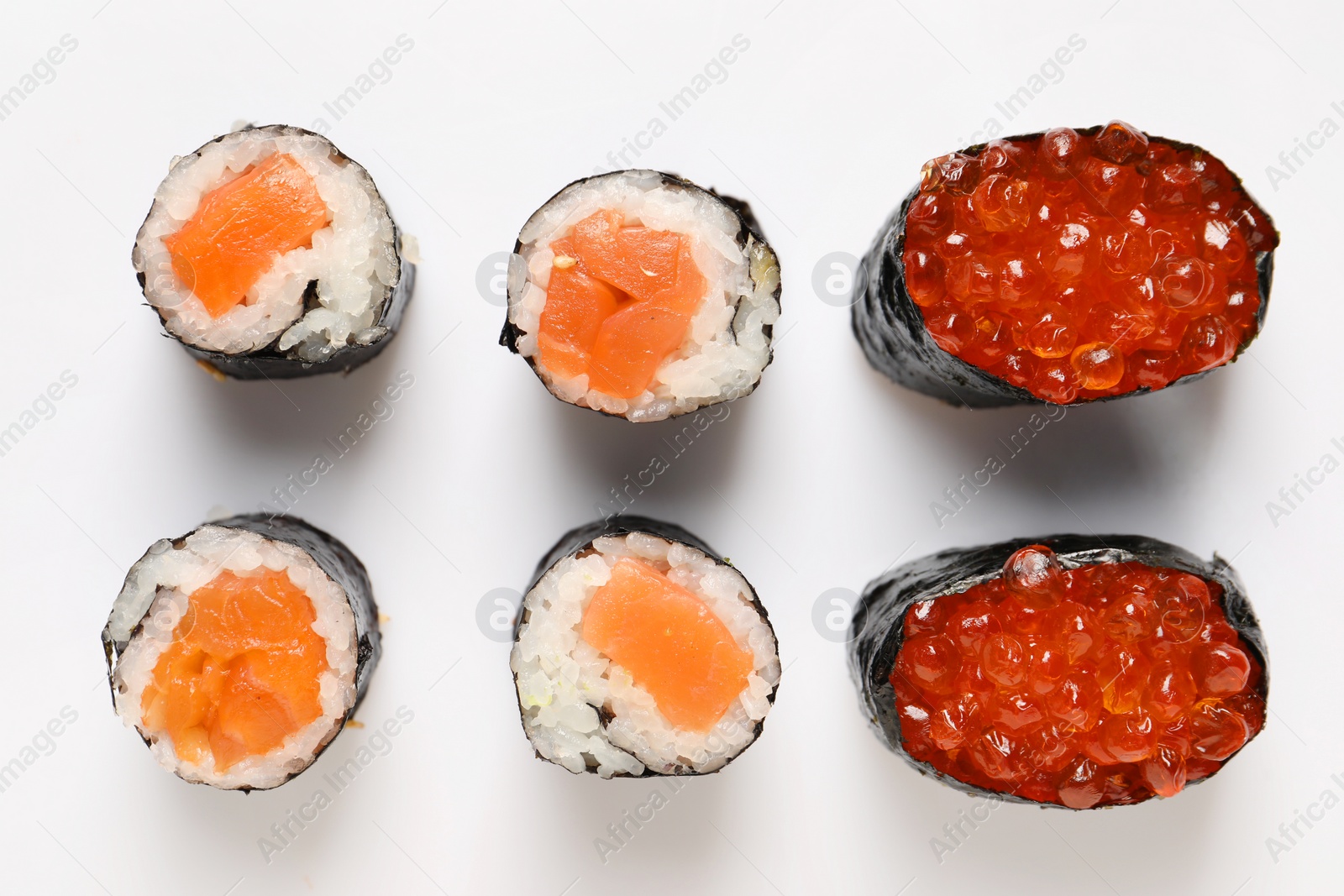 Photo of Delicious sushi rolls on white background, flat lay