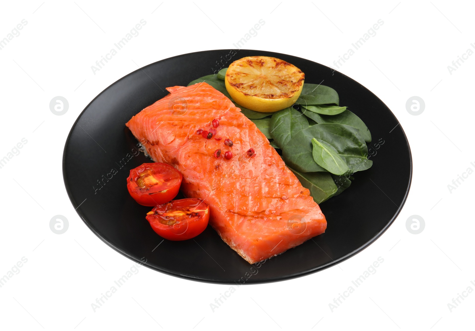 Photo of Tasty grilled salmon with tomatoes, lemon and basil