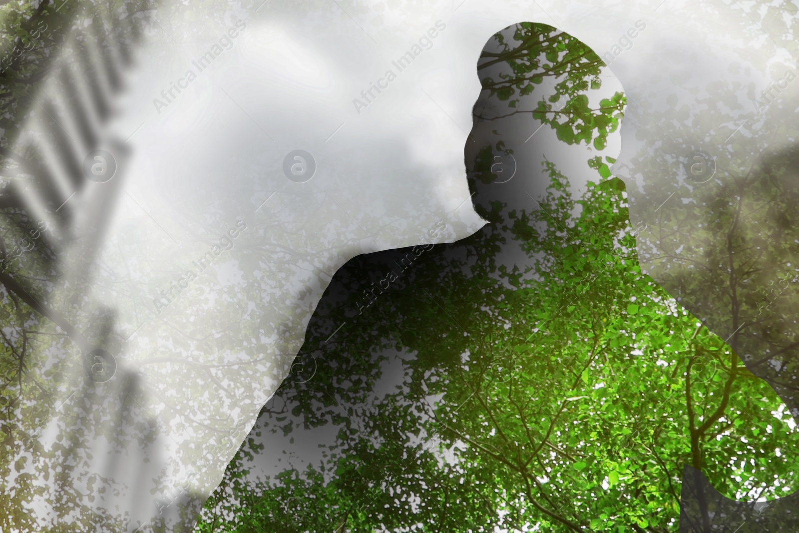 Image of Double exposure of man and green trees in city