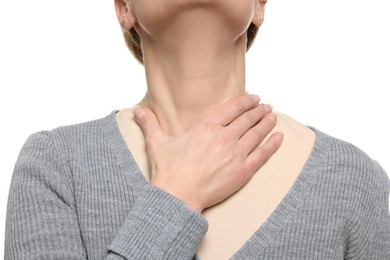 Woman suffering from sore throat on white background, closeup