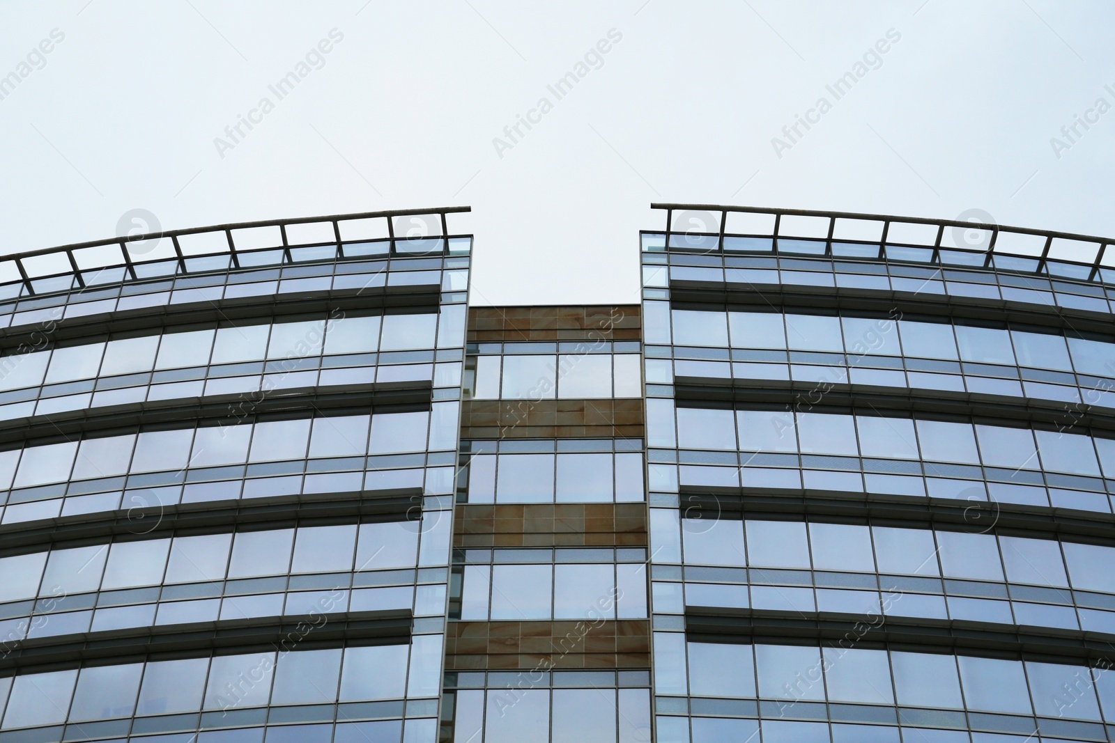 Photo of Low angle view of modern building with many windows against clear sky