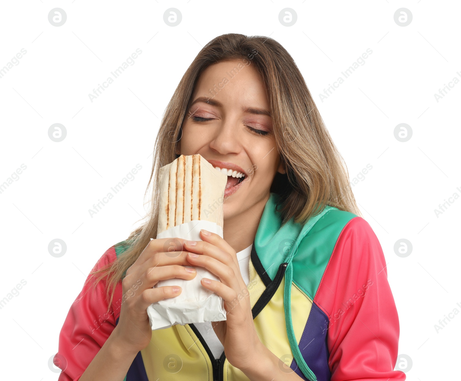 Photo of Young woman eating delicious shawarma on white background