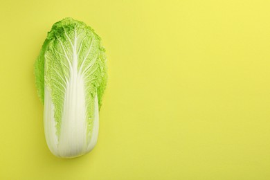 Fresh ripe Chinese cabbage on green background, top view. Space for text