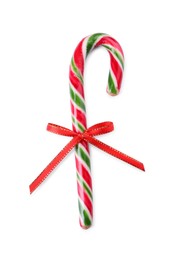 Sweet Christmas candy cane with red bow on white background, top view