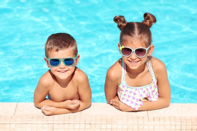 Photo of Happy cute little children in swimming pool