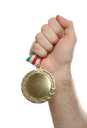 Photo of Man holding golden medal on white background, closeup. Space for design