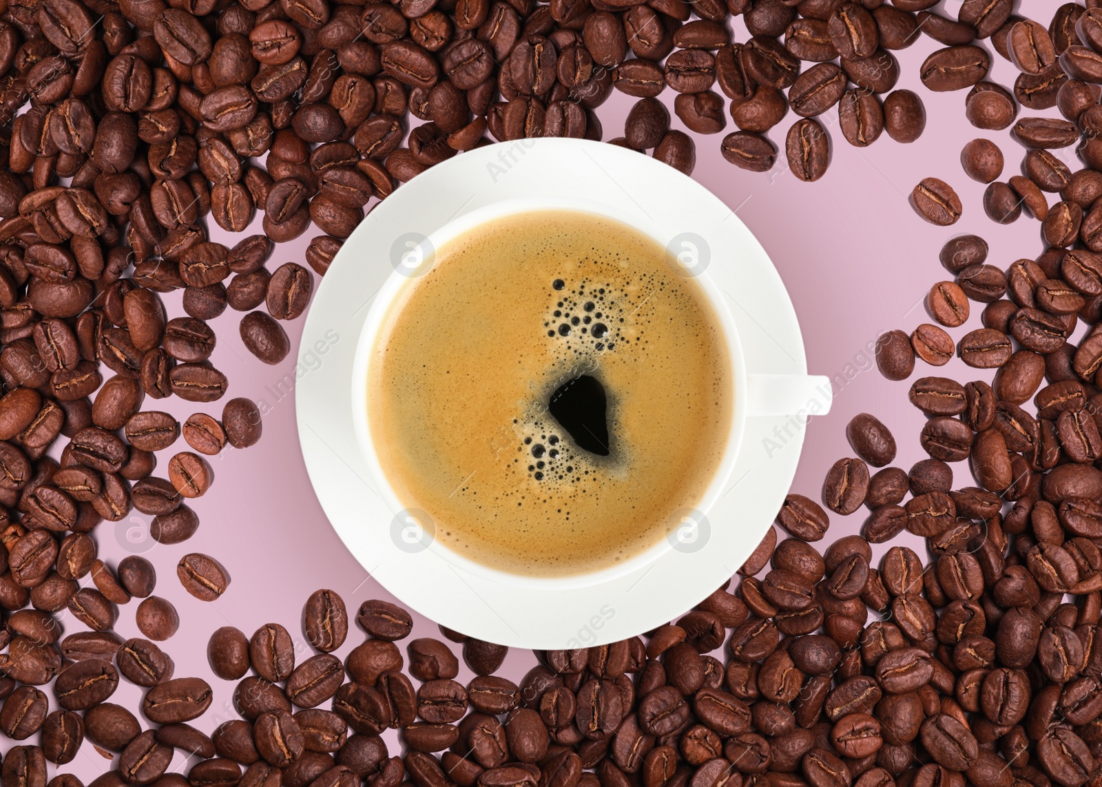 Image of Cup of tasty espresso and roasted coffee beans on pink background, flat lay