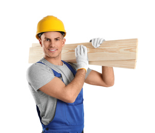 Photo of Handsome carpenter with wooden planks on light background