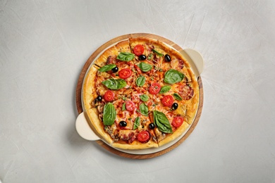 Photo of Tasty homemade pizza on table, top view