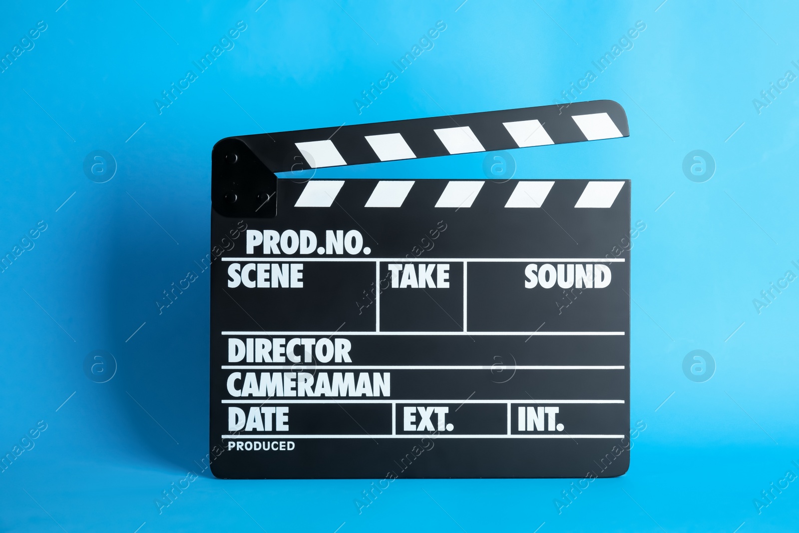 Photo of Clapperboard on color background. Modern cinema production