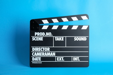 Clapperboard on color background. Modern cinema production