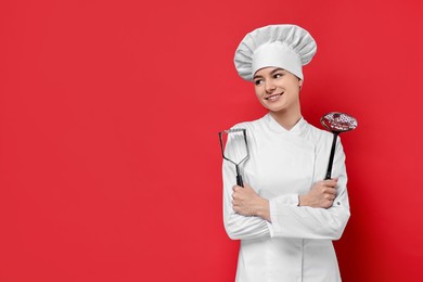 Photo of Professional chef with potato pusher and skimmer on red background. Space for text