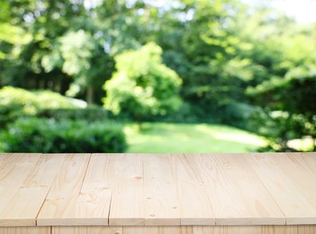 Image of Empty wooden surface outdoors on sunny day. Space for design