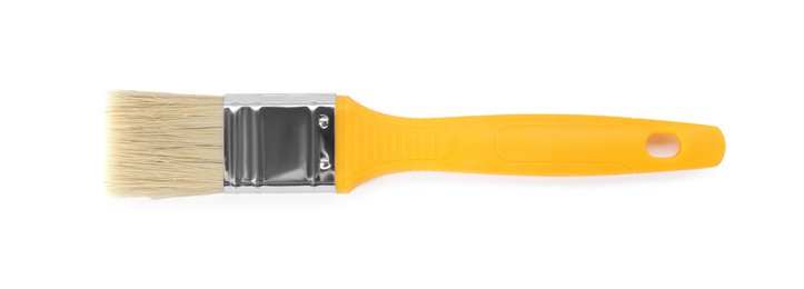 Photo of One paint brush with yellow handle isolated on white, top view