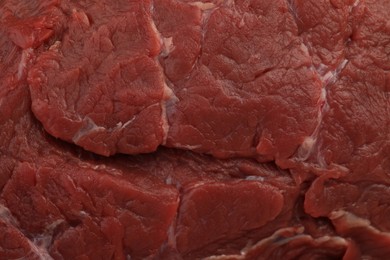 Photo of Piece of raw beef meat as background, top view