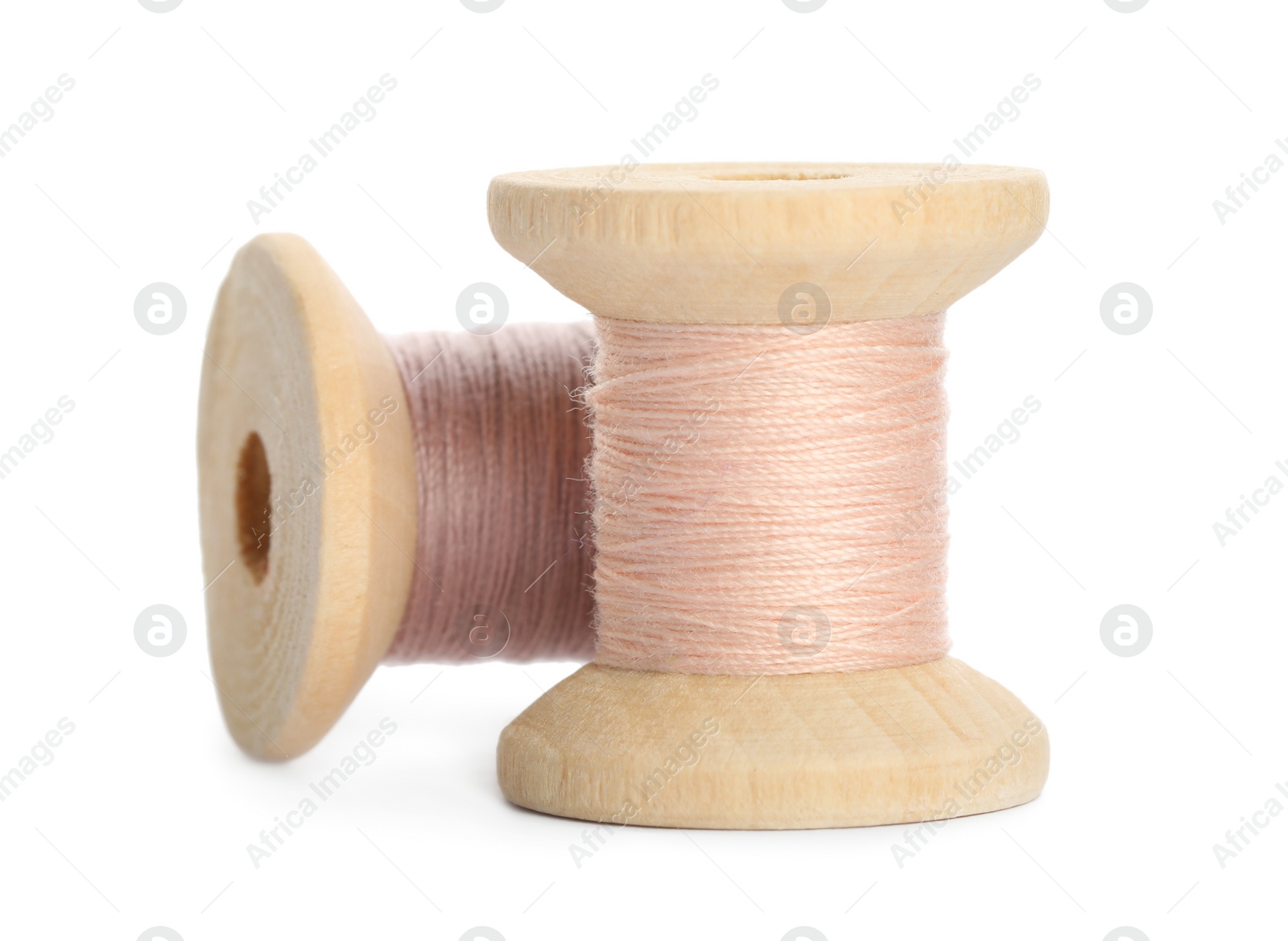 Photo of Different colorful sewing threads on white background