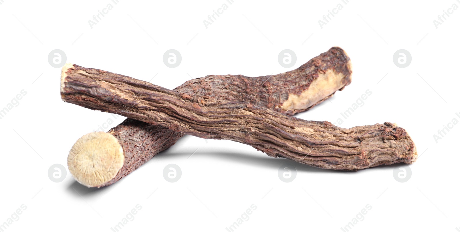 Photo of Dried sticks of liquorice root on white background