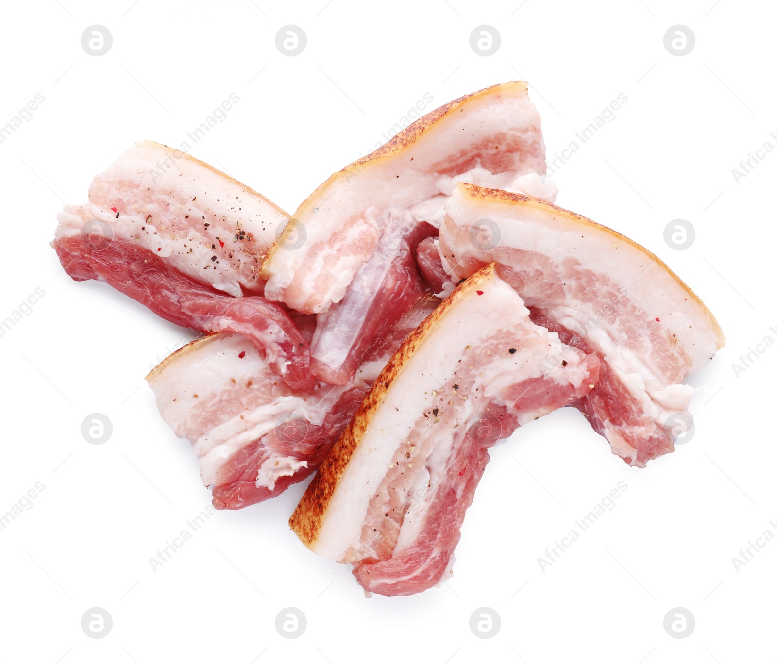 Photo of Slices of tasty pork fatback with spices on white background, top view