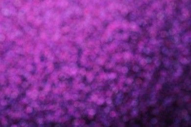 Photo of Shiny purple background with magical bokeh effect