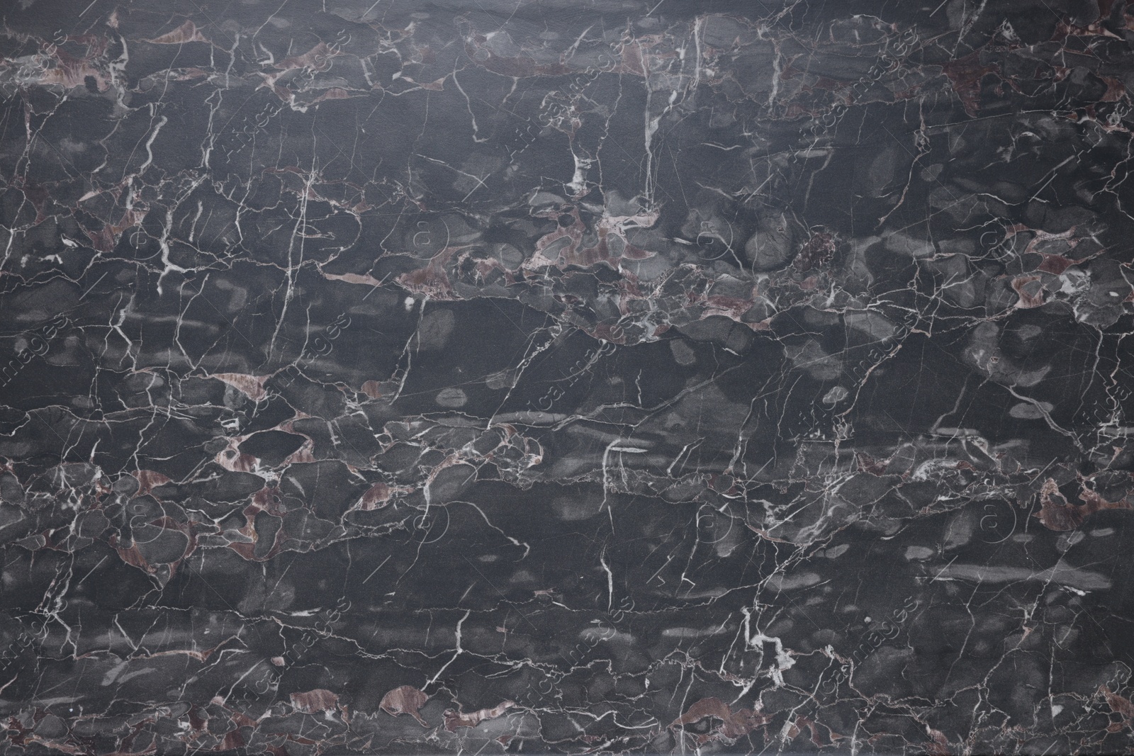 Photo of Dark grey marble surface as background, closeup