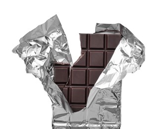 Photo of Broken dark chocolate bar wrapped in foil isolated on white, top view
