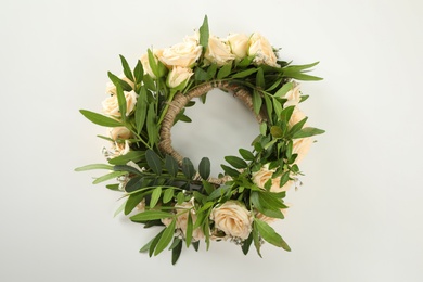 Photo of Wreath made of beautiful flowers isolated on white, top view