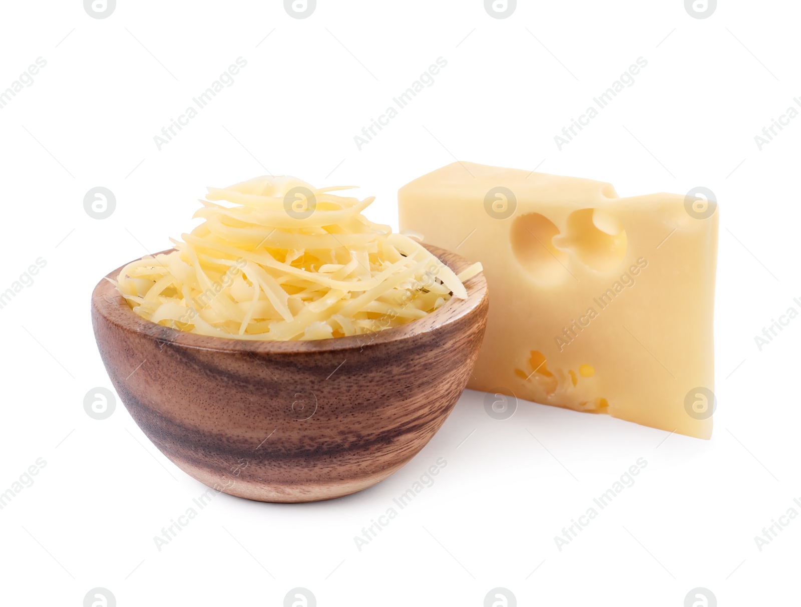 Photo of Grated cheese in bowl and piece of one isolated on white