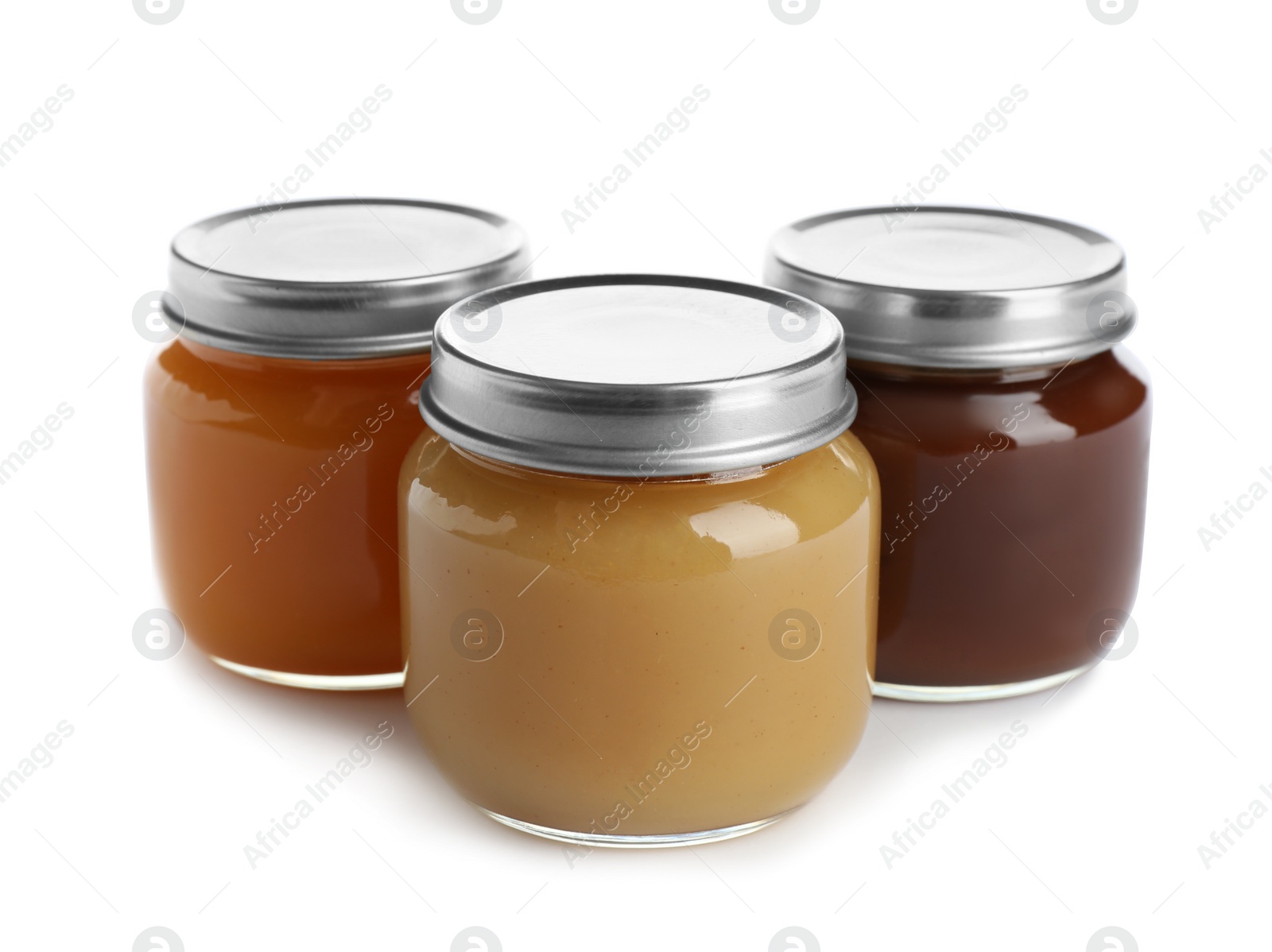 Photo of Jars with healthy baby food on white background