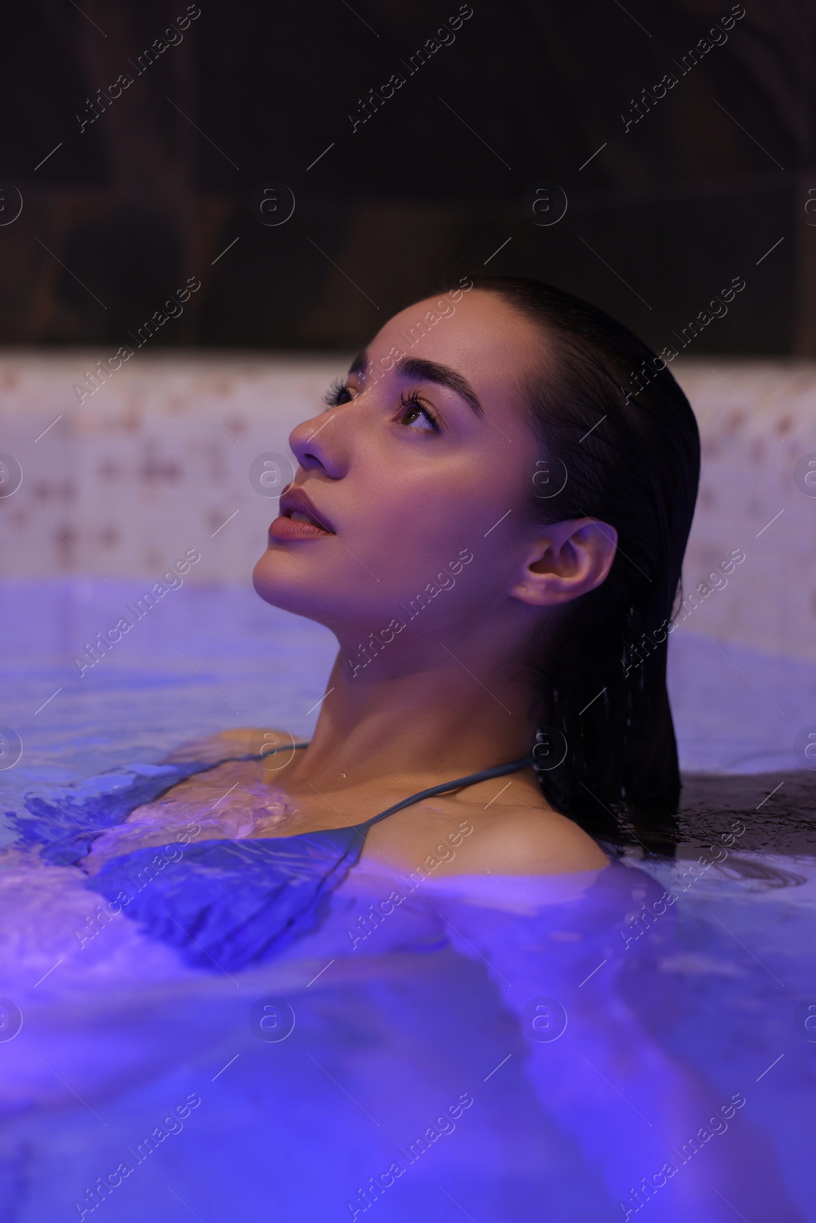 Photo of Beautiful woman relaxing in spa swimming pool