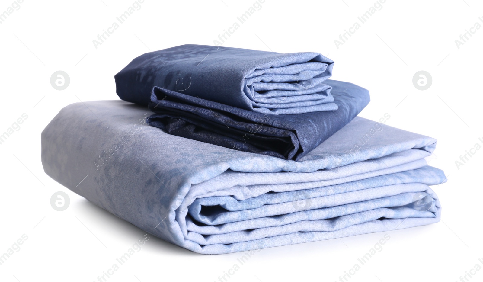 Photo of Stack of clean bed linen isolated on white