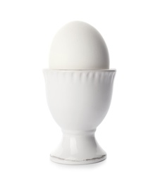 Photo of Holder with boiled egg on white background