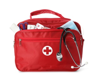 First aid kit with stethoscope on white background