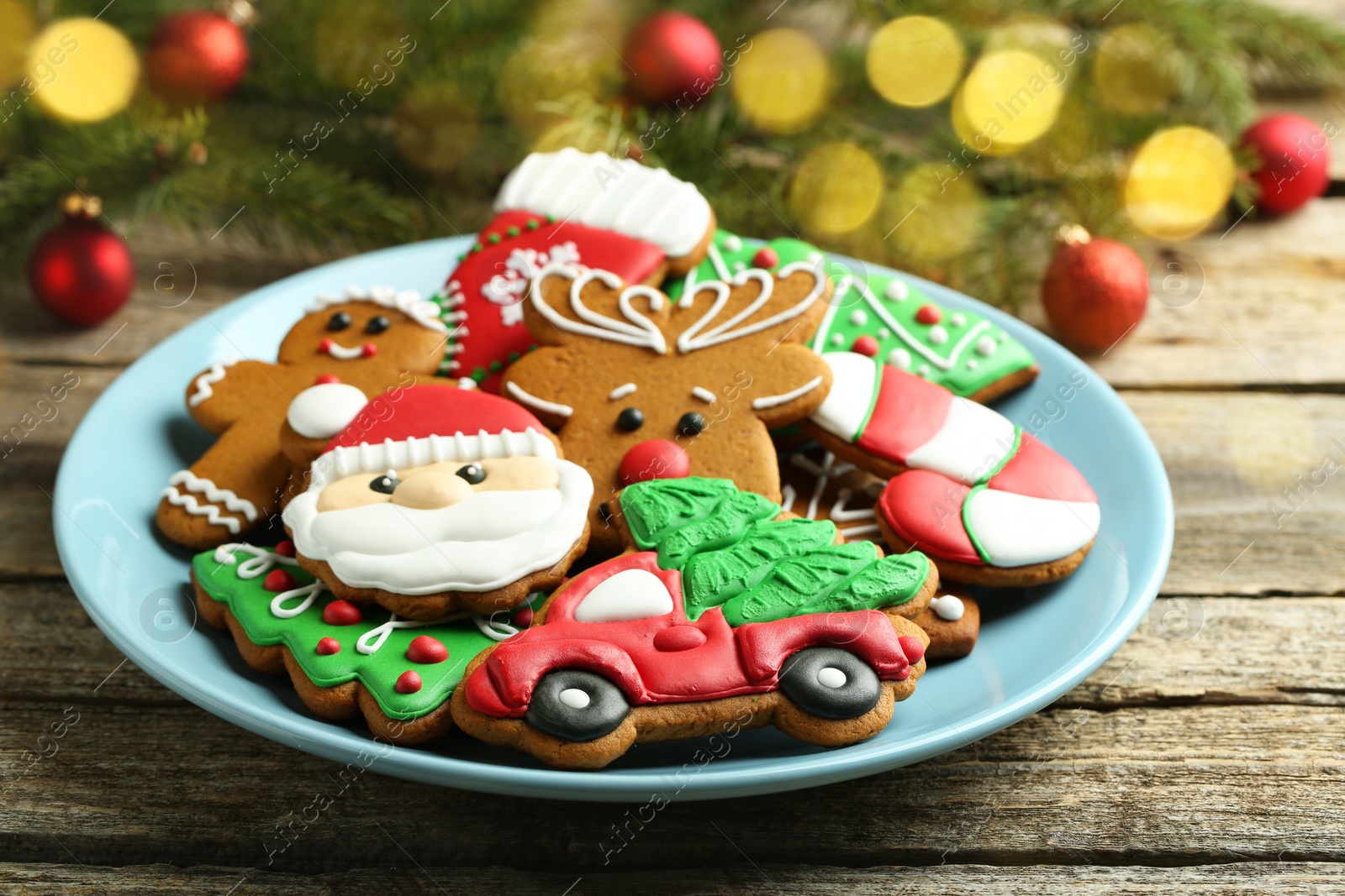 Photo of Different tasty Christmas cookies on wooden table, closeup. Space for text