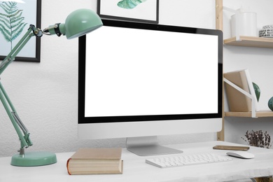 Photo of Comfortable workplace with modern computer on table