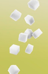 Refined sugar cubes in air on color gradient background