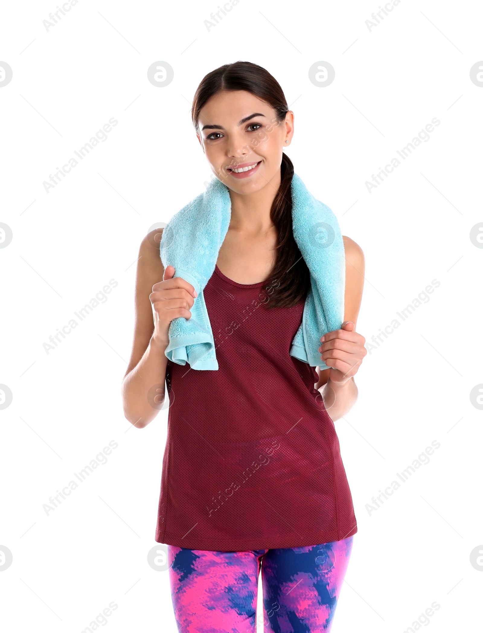 Photo of Beautiful young woman in sportswear with towel on white background