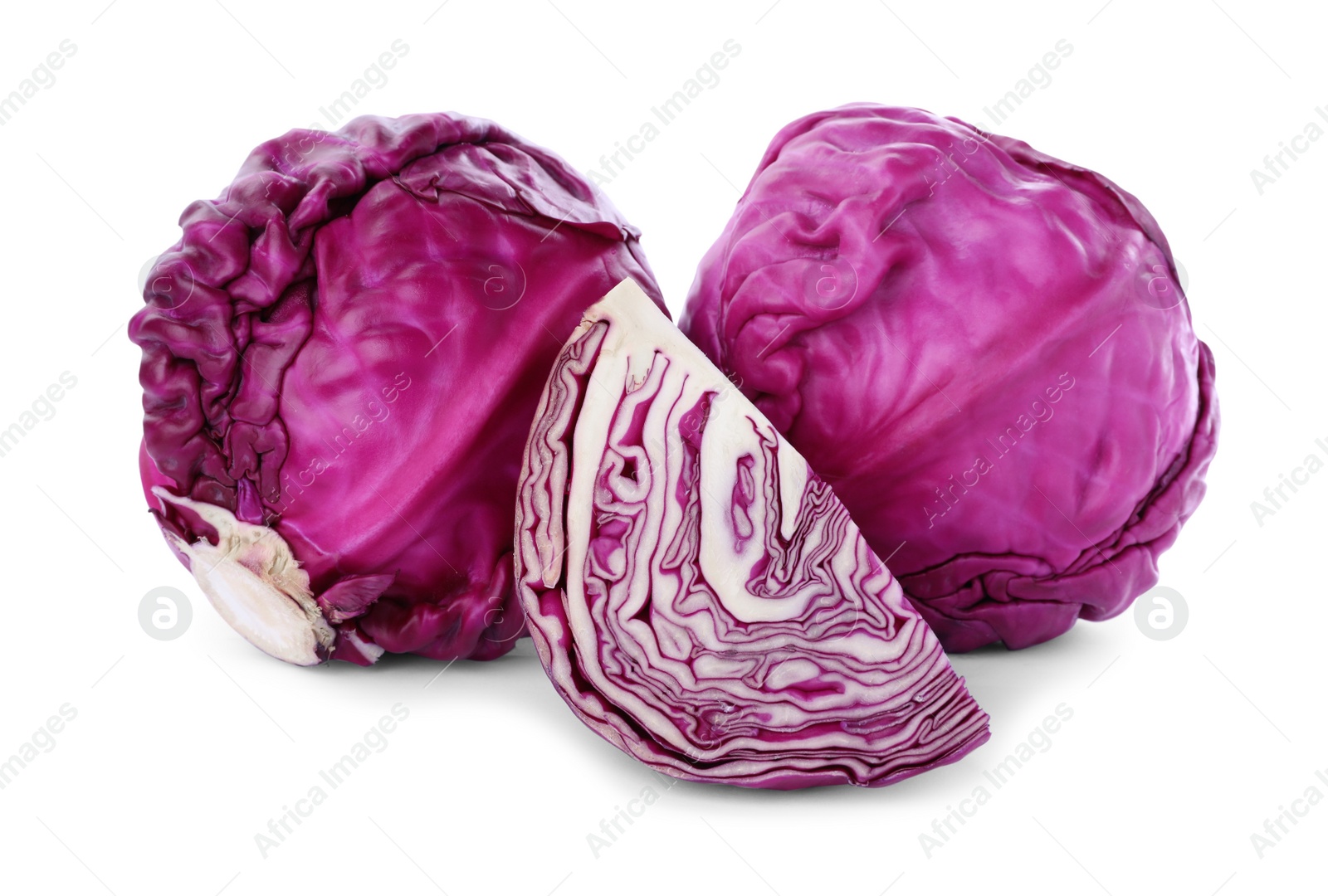 Photo of Whole and cut red cabbages on white background